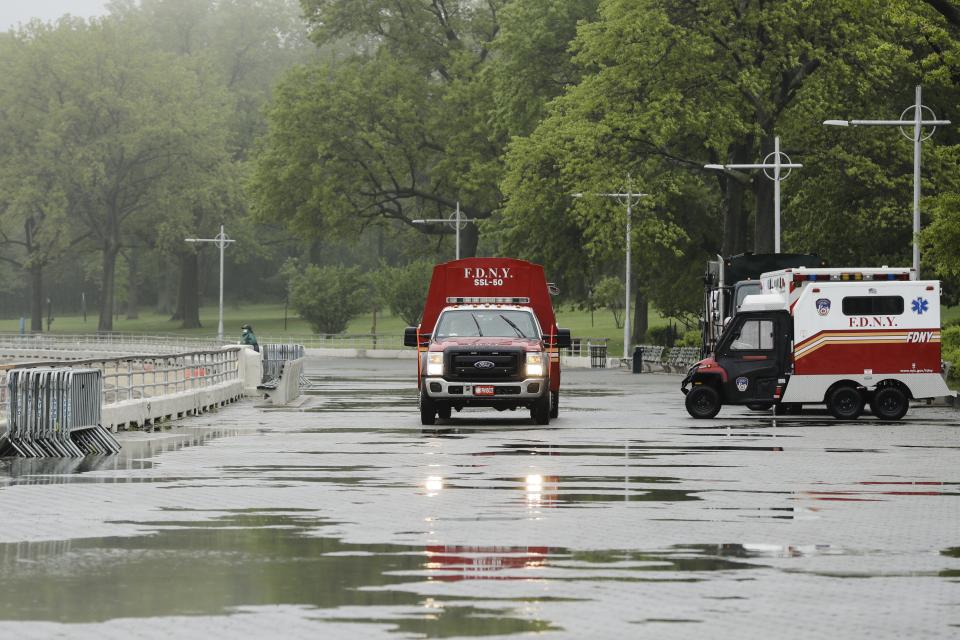 New York City Fire Department vehicle drives along an empty Orchard Beach Saturday, May 23, 2020, in the Bronx borough of New York. Gov. Andrew Cuomo has given New Yorkers an unexpected reprieve from cabin fever by easing the state’s ban on gatherings due to coronavirus concerns, in time for the Memorial Day weekend. New York City beaches are open this weekend. But no swimming is allowed, and masks must be worn. (AP Photo/Frank Franklin II)