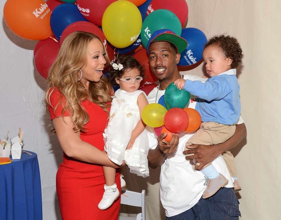 Mariah Carey, her husband Nick Cannon and their twins Monroe Cannon (L) and Moroccan Cannon attend "Family Day" hosted by Nick Cannon at Santa Monica Pier on October 6, 2012 in Santa Monica, California