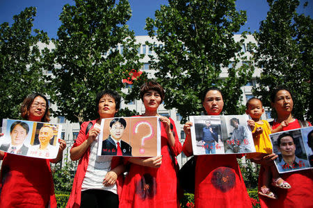 Relatives of those detained in what is known as the "709" crackdown protest in front of the Supreme People's Procuratorate in Beijing, China July 7, 2017. REUTERS/Damir Sagolj