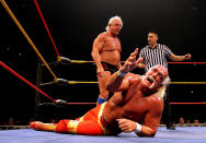 <p>Hulk Hogan grimaces in pain as his opponent Ric Flair stands over him during Hulk Hogan’s Hulkamania Tour at Rod Laver Arena on November 21, 2009 in Melbourne, Australia. (Photo by Mark Dadswell/Getty Images) </p>