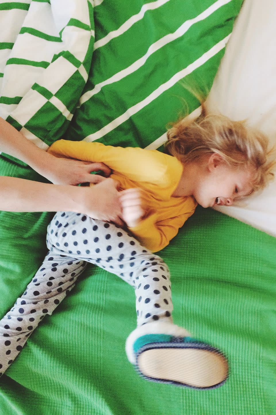 WITH YOUR DAUGHTER: Start an all-out tickle fight.