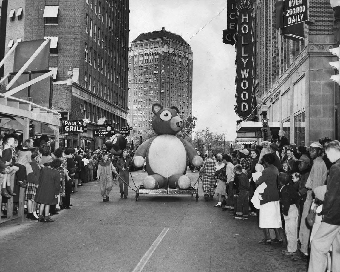 Nov. 23, 1951: A teddy bear parade float, being pulled by Boy Scouts, among a crowd of people at the Christmas Parade on Seventh Street in Fort Worth. The parade was held in downtown Fort Worth on the Friday after Thanksgiving. Fort Worth Star-Telegram archive/UT Arlington Special Collections