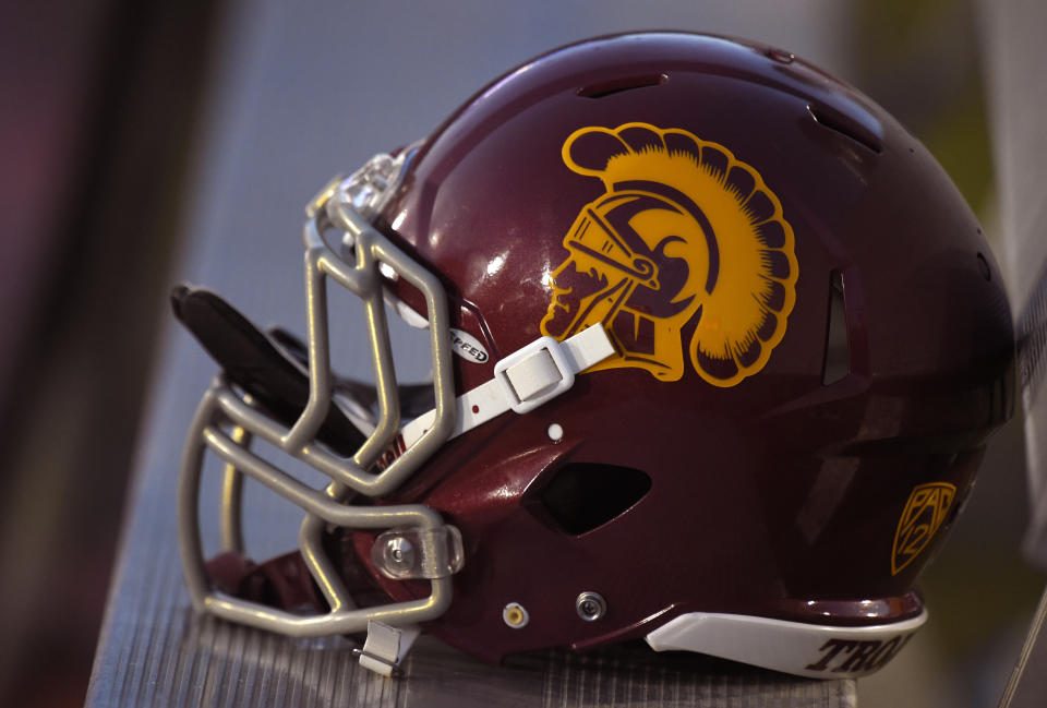 A Southern California helmet sits on a bench during the second half of an NCAA college football game against Fresno State, Saturday, Aug. 30, 2014, in Los Angeles.  USC won 52-13. (AP Photo/Mark J. Terrill)