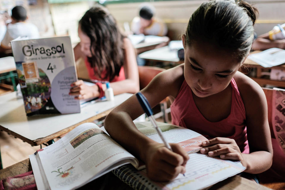 Girls attend a class at a school in the forest in Xapuri, Acre State, in northwestern Brazil, on October 8, 2014. 