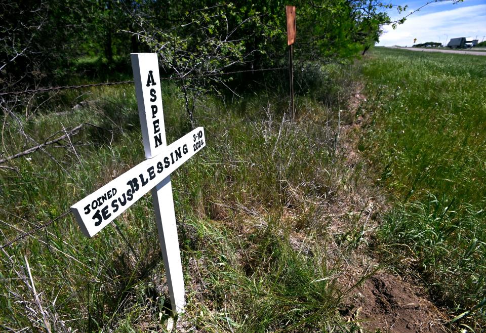 A marker for Aspen Blessing stands off the westbound Interstate-20 access road, less than a mile from the Callahan County rest stop Tuesday April 16, 2024. Blessing, 18, died in a collision near here on March 10.