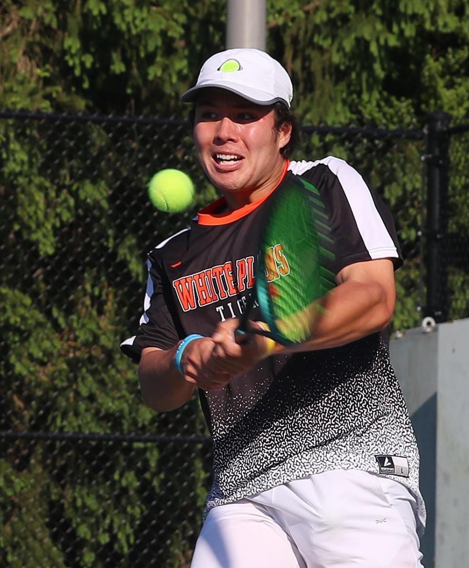 White Plains' Callum Markowitz returns a shot against Mamaroneck's Maxim Kalinin on his way to winning the Section 1 boys single tennis championship at Harrison High School May 22, 2024.