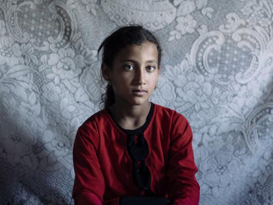 Moza, eight, has been caring for her mother in Mosul and started school two years late (Paddy Dowling/EAA)