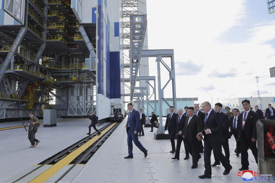 In this photo provided by the North Korean government, Russian President Vladimir Putin and North Korean leader Kim Jong Un, both at center right, visit the Vostochny cosmodrome outside the city of Tsiolkovsky, about 200 kilometers (125 miles) from the city of Blagoveshchensk in the far eastern Amur region, Russia, Wednesday, Sept. 13, 2023. Independent journalists were not given access to cover the event depicted in this image distributed by the North Korean government. The content of this image is as provided and cannot be independently verified. Korean language watermark on image as provided by source reads: "KCNA" which is the abbreviation for Korean Central News Agency. (Korean Central News Agency/Korea News Service via AP)