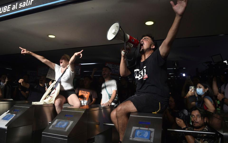 Anti-Milei protesters demonstrate in Buenos Aires on Friday over the president's plans to cut subsidies for students using public transport