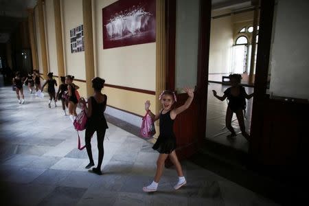 A child reacts to the camera at the Cuba's National Ballet School (ENB) in Havana, Cuba, October 12, 2016. Picture taken October 12, 2016. REUTERS/Alexandre Meneghini