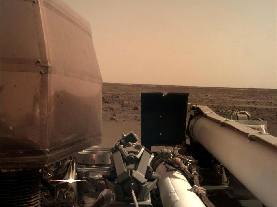 The Instrument Deployment Camera (IDC), located on the robotic arm of NASA's InSight lander, took this image of the Martian surface the day the spacecraft touched down on the Red Planet, and was relayed from InSight to Earth via NASA's Odyssey spacecraft, currently orbiting Mars, on November 26, 2018.    Picture taken November 26, 2018.   NASA/JPL-Caltech/Handout via REUTERS     ATTENTION EDITORS - THIS IMAGE WAS PROVIDED BY A THIRD PARTY.?