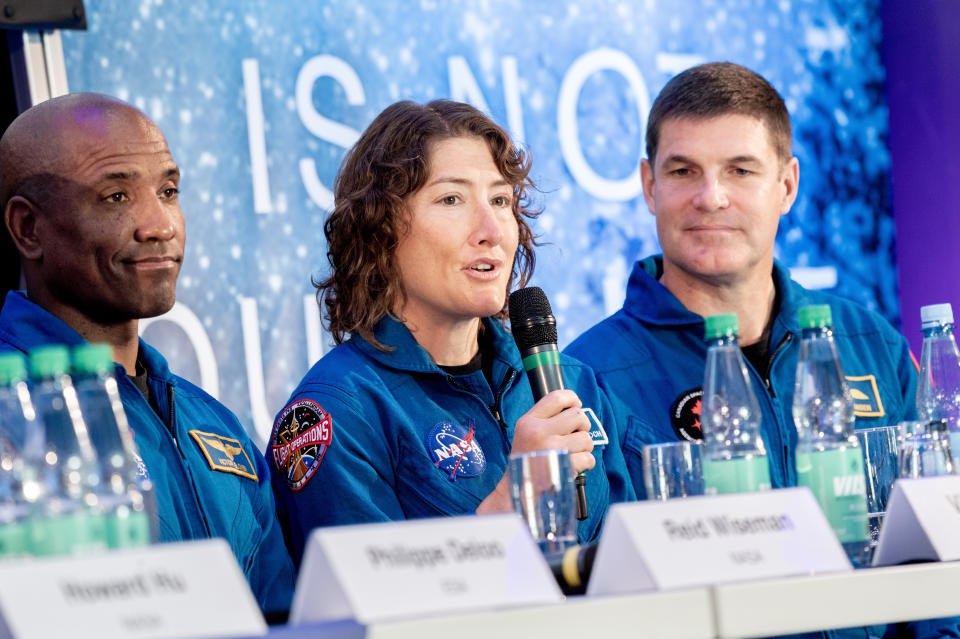 15 September 2023, Bremen: The crew members of NASA's Artemis 2 mission, Victor Glover (l-r), Christina Koch and Jeremy Hansen, sit in front of journalists during a press conference. They reported on the upcoming 