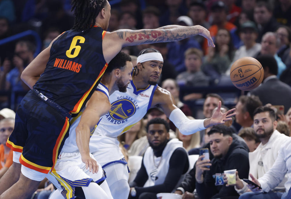 Nov 3, 2023; Oklahoma City, Oklahoma, USA; Oklahoma City Thunder forward Jaylin Williams (6), Golden State Warriors guard Stephen Curry (30) and guard Moses Moody (4) reach for a loose ball during the second quarter at Paycom Center. Mandatory Credit: Alonzo Adams-USA TODAY Sports