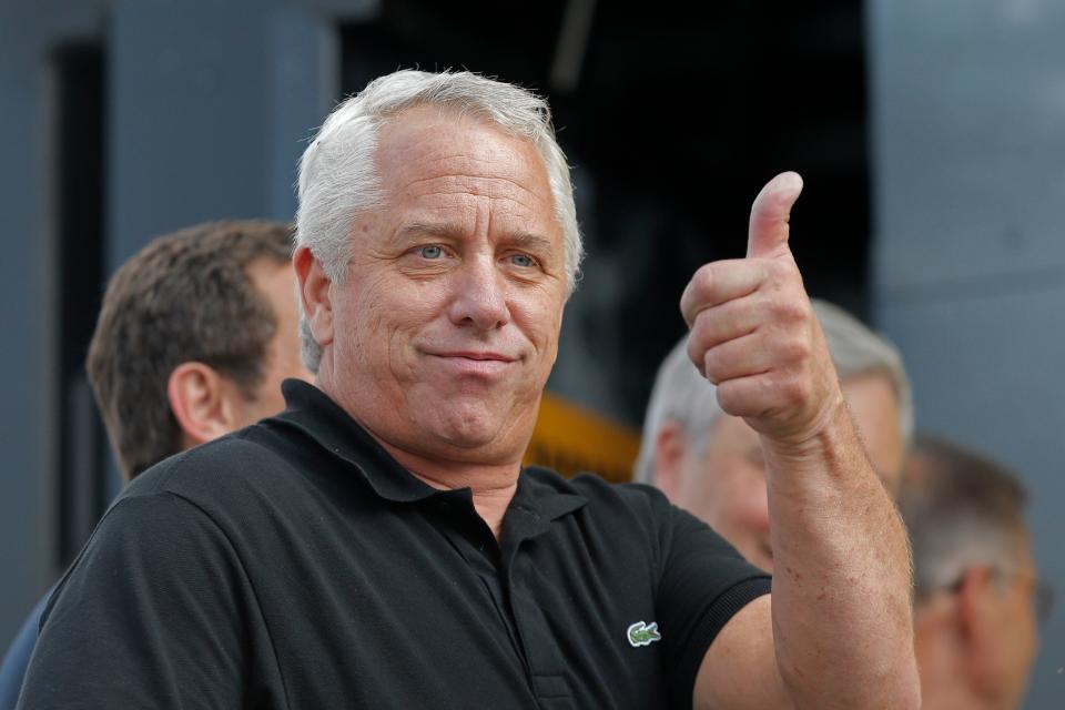 Greg Lemond expresses his approval during the podium ceremony after the 15th stage of the 2013 Tour de France.