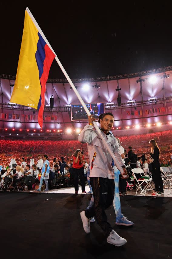 RIO DE JANEIRO, BRAZIL - SEPTEMBER 18: Gold, silver and bronze medalist Carlos Daniel Serrano carries the flag for Colombia during the closing ceremony of the Rio 2016 Paralympic Games at Maracana Stadium on September 18, 2016 in Rio de Janeiro, Brazil. (Photo by Atsushi Tomura/Getty Images for Tokyo 2020)