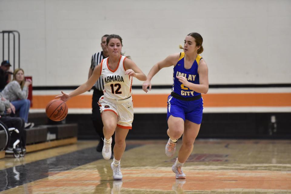 Armada's Ava Baltierra pushes the ball down the court during the Tigers' 66-37 loss to Imlay City on Tuesday.