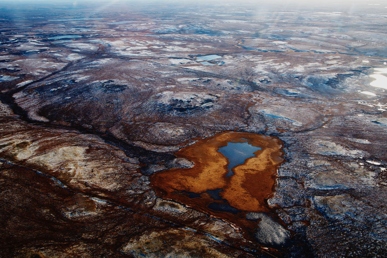 Aerial view and top view of the river in the tundra on the Taimyr Peninsula in Russia. Beautiful natural background. Blurred image, selective focus.