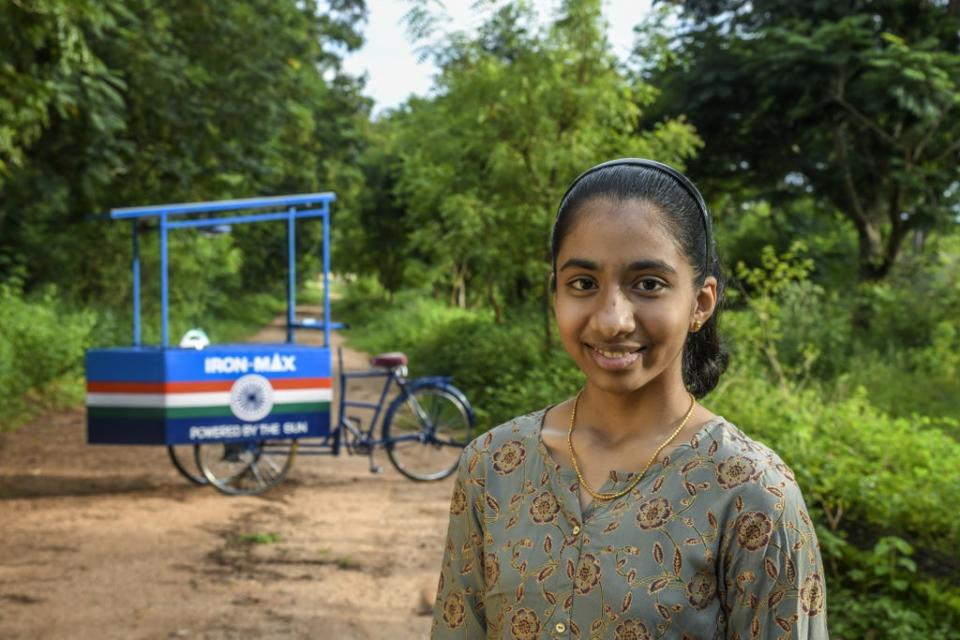 Vinisha Umashankar with the solar-powered ironing cart she designed (Earthshot Prize/PA) (PA Media)