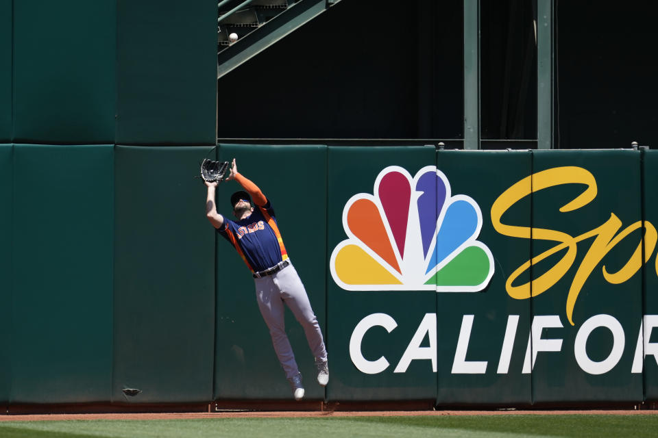 Houston Astros center fielder Chas McCormick catches a fly out hit by Oakland Athletics' Seth Brown during the third inning of a baseball game in Oakland, Calif., Saturday, May 27, 2023. (AP Photo/Jeff Chiu)