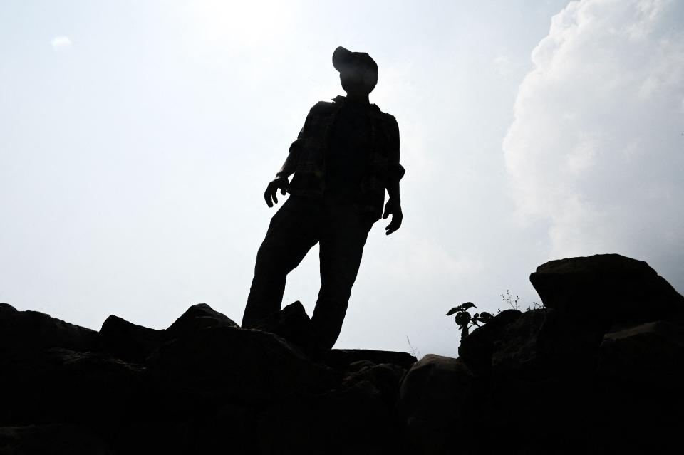 Yahya, an Afghan who identifies as gay and a non-conforming person, poses during an interview at an undisclosed location on Sept. 28. Many LGBTQ Afghans are haunted by the Taliban's brutally repressive reign from 1996 to 2001, when gay men were stoned to death or crushed by toppled walls as punishment.