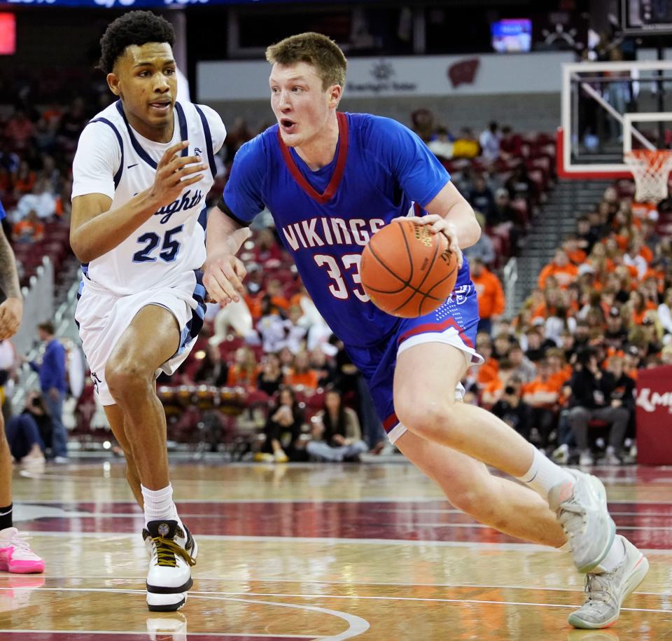 Nicolet's Davion Hannah (25) guards Wisconsin Lutheran's Kon Knueppel (33) during the second half of the WIAA Division 2 boys basketball state semifinal game on Friday March 15, 2024 at the Kohl Center in Madison, Wis.