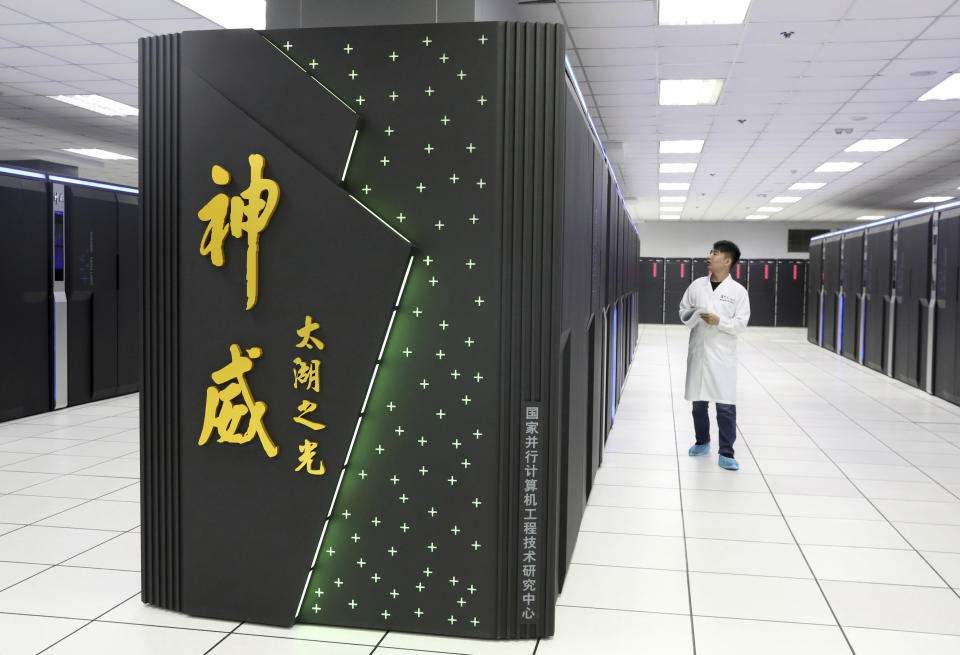 A worker monitors the Shenwei (Sunway) TaihuLight supercomputer at the National Supercomputer Center in Wuxi in eastern China's Jiangsu province on Aug. 29, 2020. The Biden administration has added seven Chinese supercomputer research labs and manufacturers to a U.S. export blacklist in a spreading conflict with Beijing over technology and security. (Chinatopix via AP)