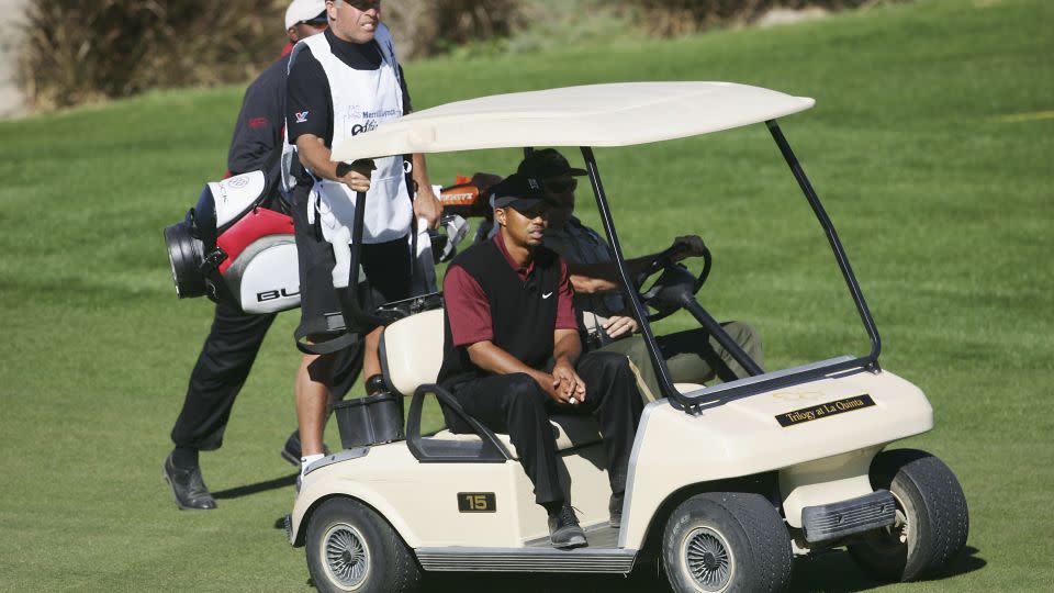 Tiger Woods rides a conventional golf cart at a tournament in 2005. - Jeff Gross/Getty Images