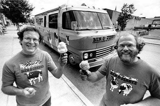 Jerry Greenfield, left, and Ben Cohen with their "Cowmobile" in Burlington, Vt., in 1987. They use the modified motor home to distribute samples of Ben & Jerry's ice cream during cross-country trips.