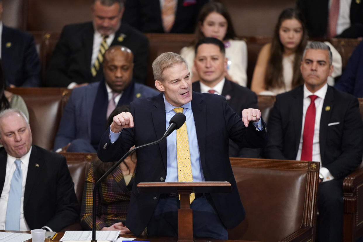 Rep. Jim Jordan, R- Ohio, speaks at a microphone in front of other House members.