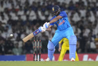 India's captain Rohit Sharma plays a shot during the second T20 cricket match between India and Australia, in Nagpur, India, Friday, Sept. 23, 2022. (AP Photo/Rafiq Maqbool)