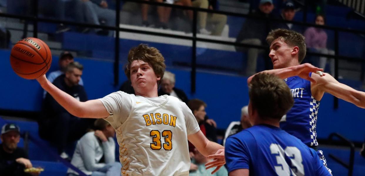 Benton Central Bison center Hunter Sisson (33) goes for a loose ball during the IHSAA boy’s basketball sectional game against the Frankfort Hot Dogs, Wednesday, March 1, 2023, at Case Arena in Frankfort, Ind. Benton Central Bison won 53-40.