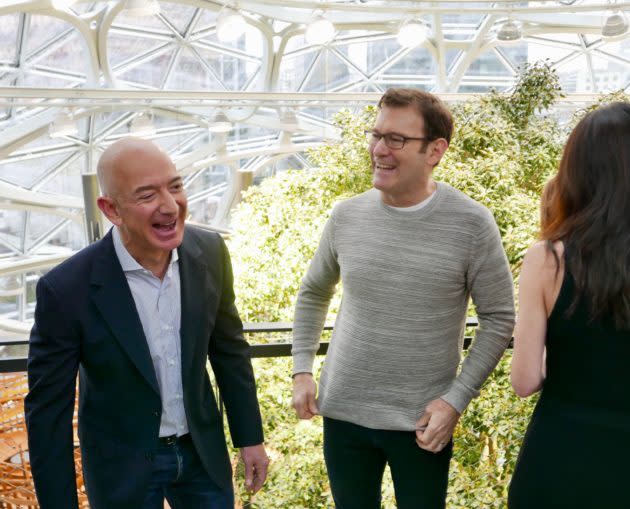 “The plants look happy,” Amazon CEO Jeff Bezos, left, said to lead horticulturalist Ron Gagliardo inside The Spheres during Amazon’s grand opening. (GeekWire Photo / Kurt Schlosser)