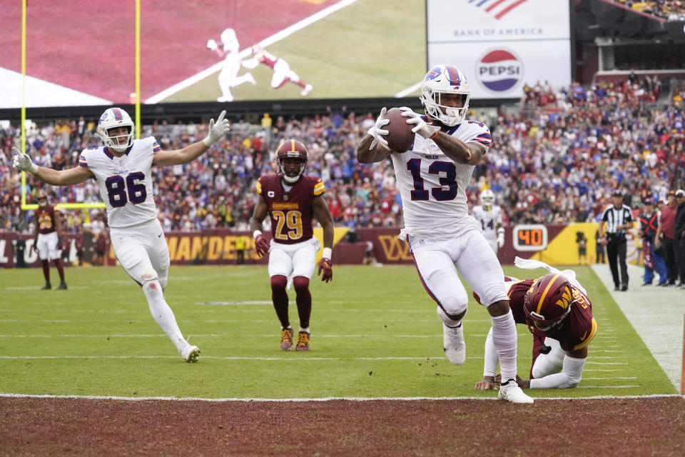 Buffalo Bills wide receiver Gabe Davis (13) scoring a touchdown against the Washington Commanders during the first half of an NFL football game, Sunday, Sept. 24, 2023, in Landover, Md. (AP Photo/Evan Vucci)