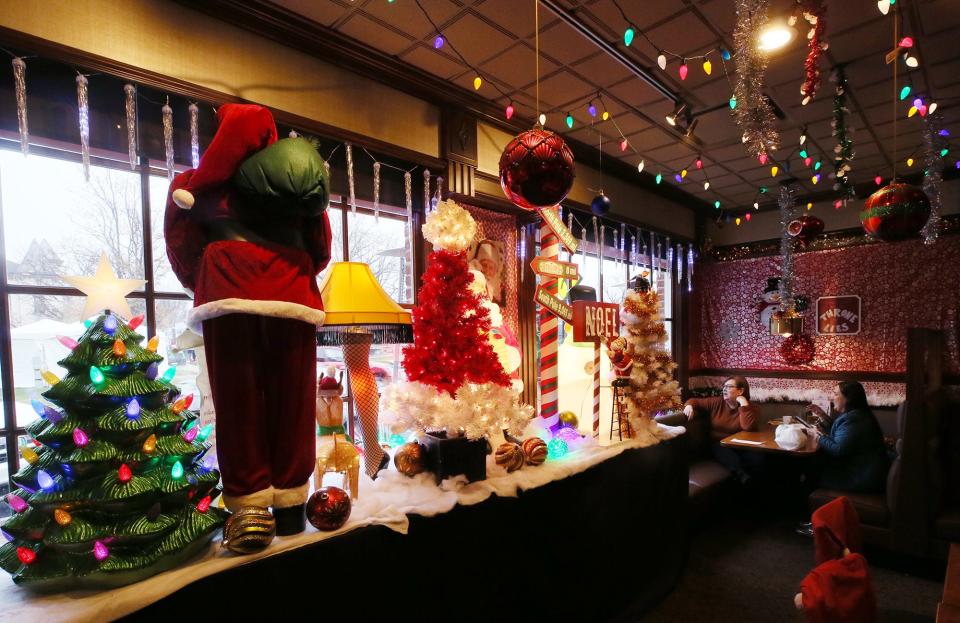 Diners take in the decorations in the front window of Blitzen's Wednesday at Hudson's Restaurant.