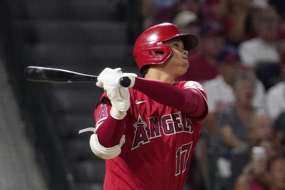 Los Angeles Angels' Shohei Ohtani hits a two-run home run during the sixth inning of a baseball game against the Colorado Rockies Tuesday, July 27, 2021, in Anaheim, Calif. (AP Photo/Mark J. Terrill)