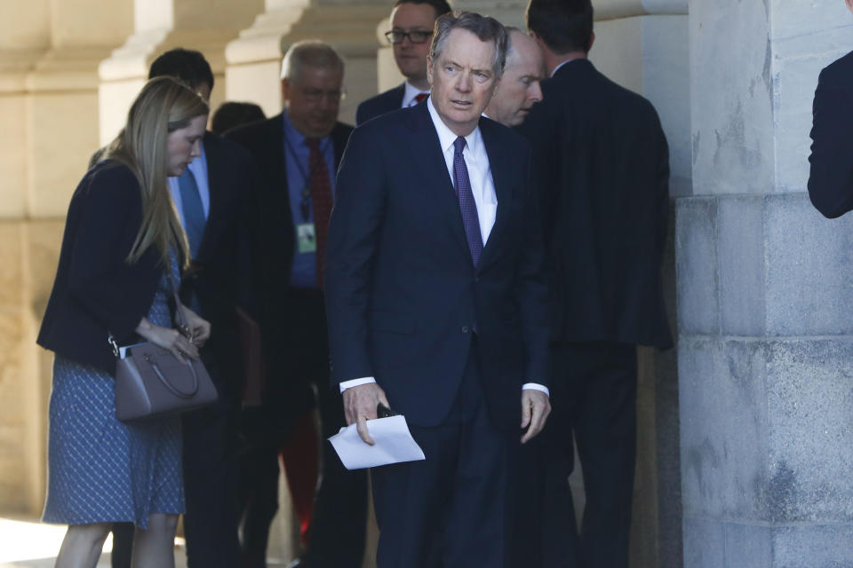 U.S. Trade Representative Robert Lighthizer, center, and members of his staff leave the U.S. Capitol, Thursday, Jan. 16, 2020. Earlier the Senate overwhelmingly approved a new North American trade agreement that rewrites the rules of trade with Canada and Mexico and gives President Donald Trump a major policy win before senators turn their full attention ti his impeachment trial. (AP Photo/Pablo Martinez Monsivais)