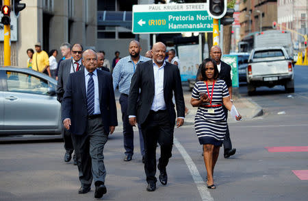 South Africa's Finance Minister Pravin Gordhan (L) walks with his deputy, Mcebisi Jonas (C) to a court hearing in Pretoria, South Africa, March 28, 2017. REUTERS/Siphiwe Sibeko