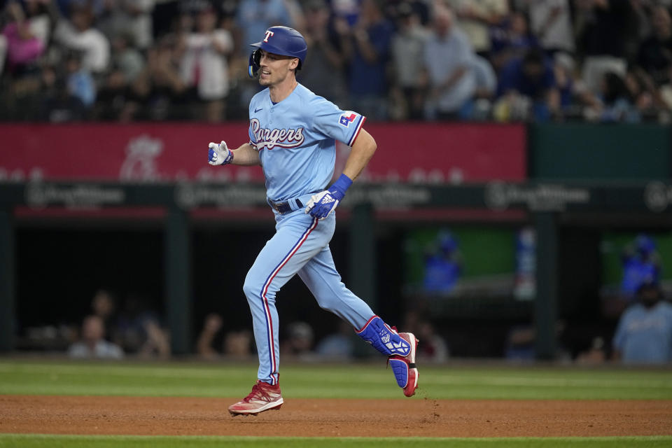 Texas Rangers' Evan Carter rounds the bases after hitting a two-run home run in the sixth inning of a baseball game against the Seattle Mariners, Sunday, Sept. 24, 2023, in Arlington, Texas. (AP Photo/Tony Gutierrez)