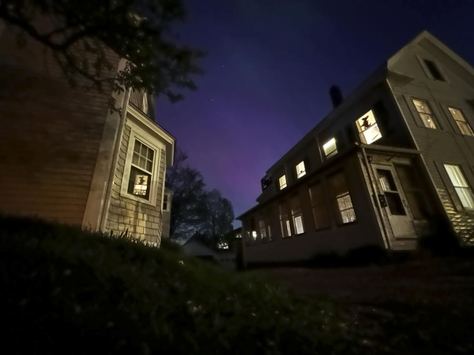 The northern lights shine over Portsmouth, N.H., Friday, May 10, 2024. (AP Photo/Caleb Jones)