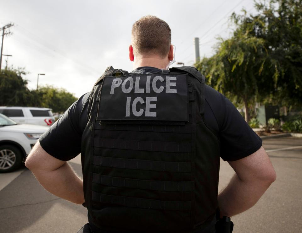 A U.S. Immigration and Customs Enforcement (ICE) officer looks on during an operation in Escondido, Calif. on July 8, 2019.