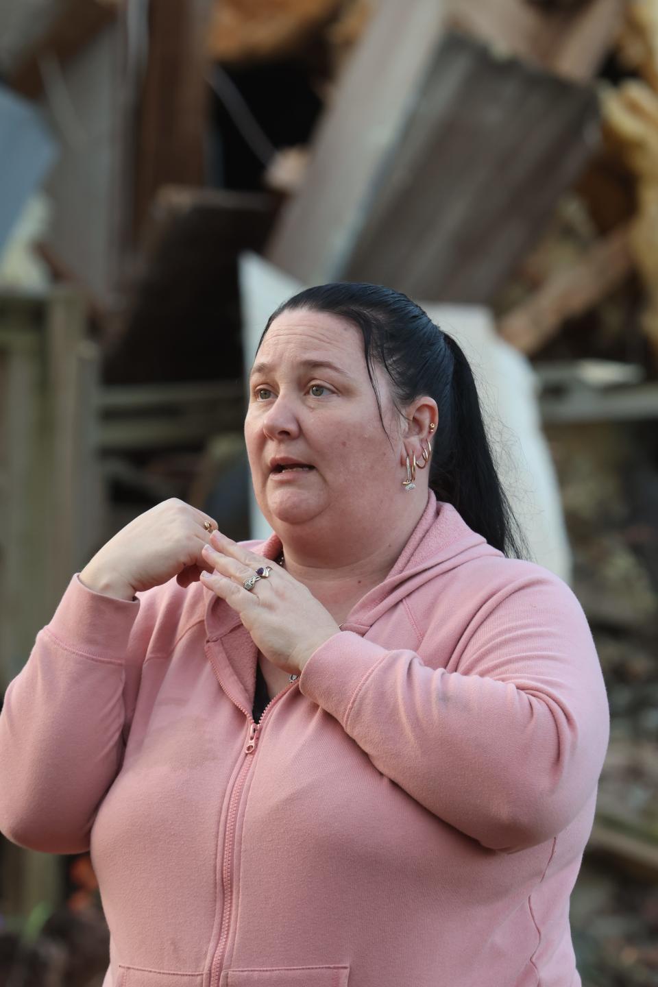 Felicia Valadez talks about losing her mobile home in the tornado in Clarksville as she goes back to salvage items at the scene on Dec. 13, 2023.