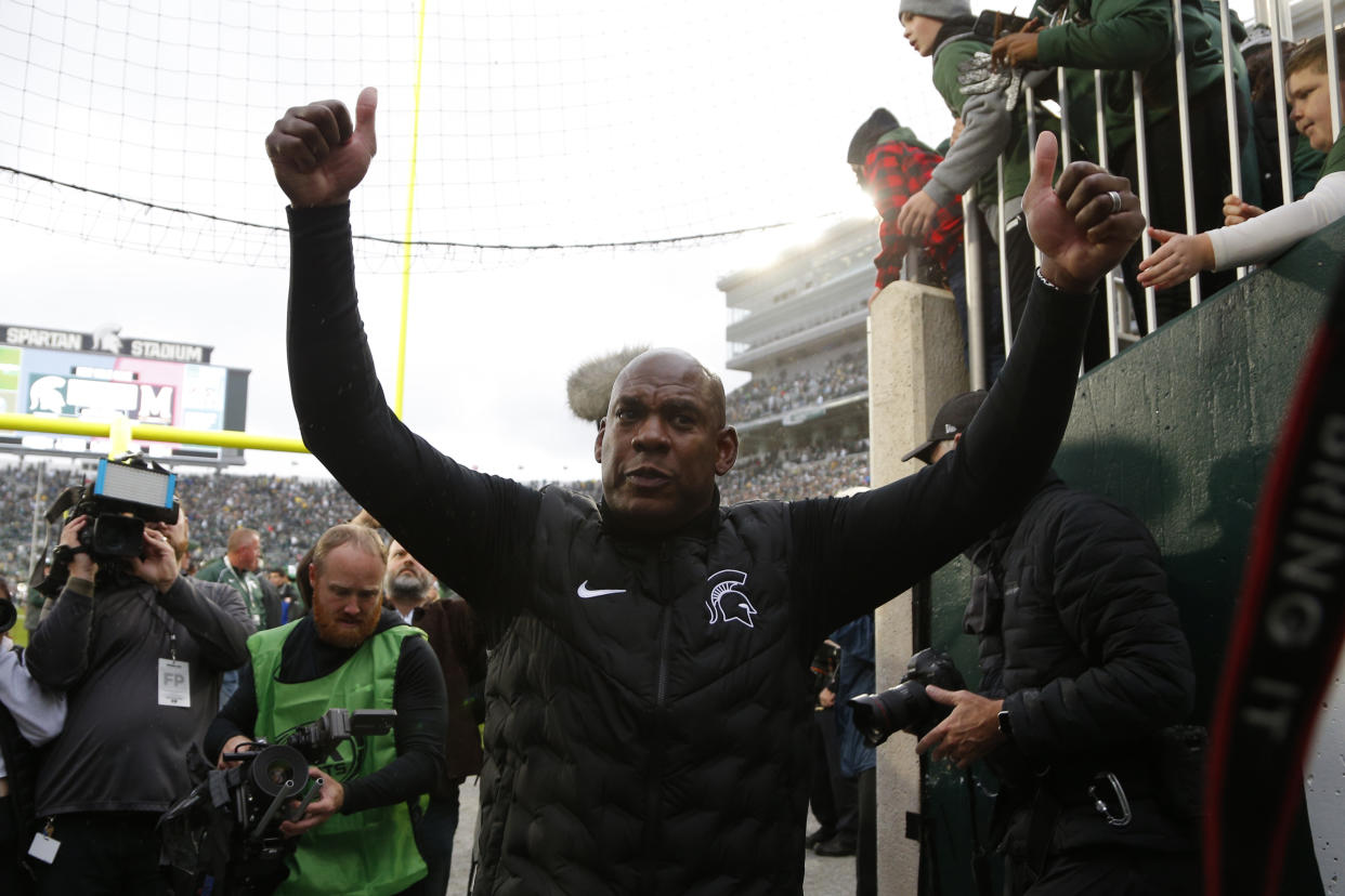 Michigan State coach Mel Tucker reacts as he leaves the field after defeating Michigan in an NCAA college football game, Saturday, Oct. 30, 2021, in East Lansing, Mich. Michigan State won 37-33. (AP Photo/Al Goldis)