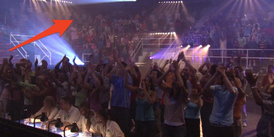 The crowd cheering and standing at the big competition in Jump In