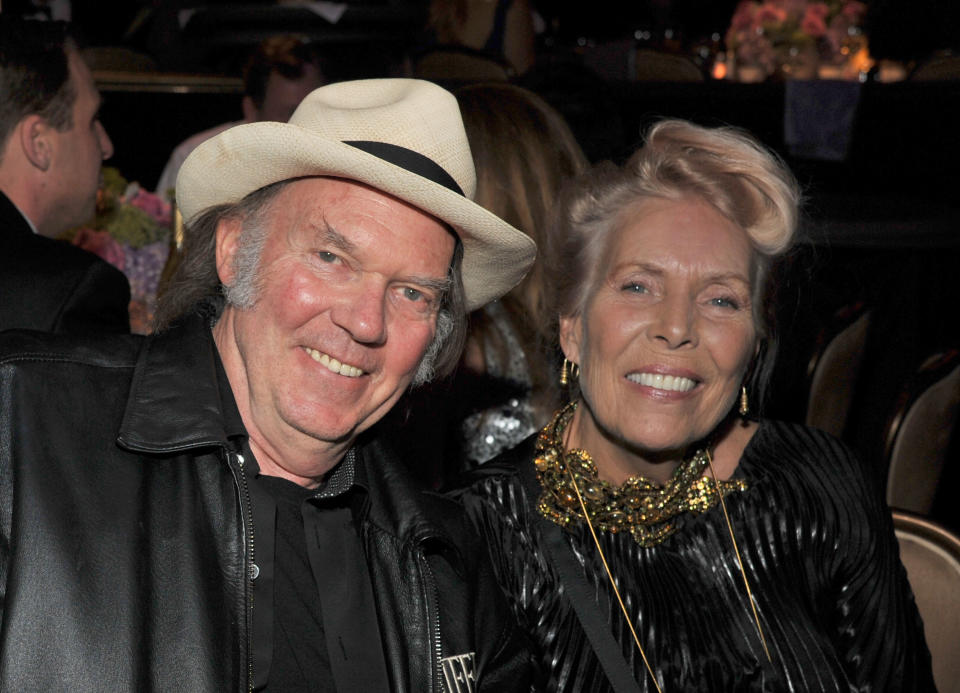 BEVERLY HILLS, CA - FEBRUARY 11:  Singers Neil Young (L) and Joni Mitchell attend Clive Davis and The Recording Academy's 2012 Pre-GRAMMY Gala and Salute to Industry Icons Honoring Richard Branson at The Beverly Hilton hotel on February 11, 2012 in Beverly Hills, California.  (Photo by Lester Cohen/WireImage)