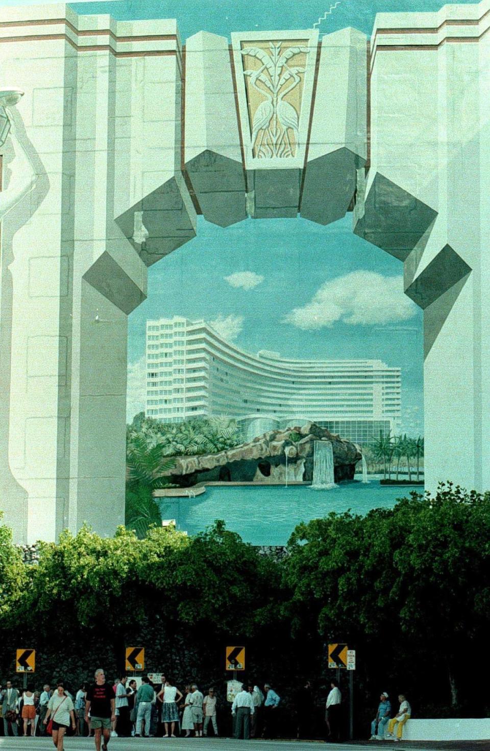 In 1997, the landmark mural on the wlal of a building that creates an illusion of looking through an arch to the hotel beyond. A group protested at the base of the mural to protest its removal to make way for a new hotel tower.