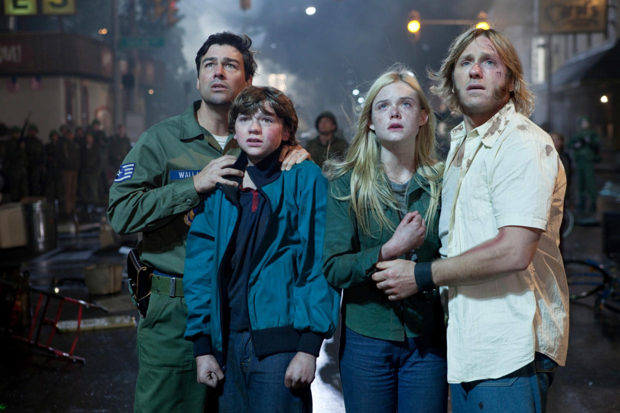 Kyle Chandler, Joel Courtney, Elle Fanning and Ron Eldard appear in the 2011 movie 