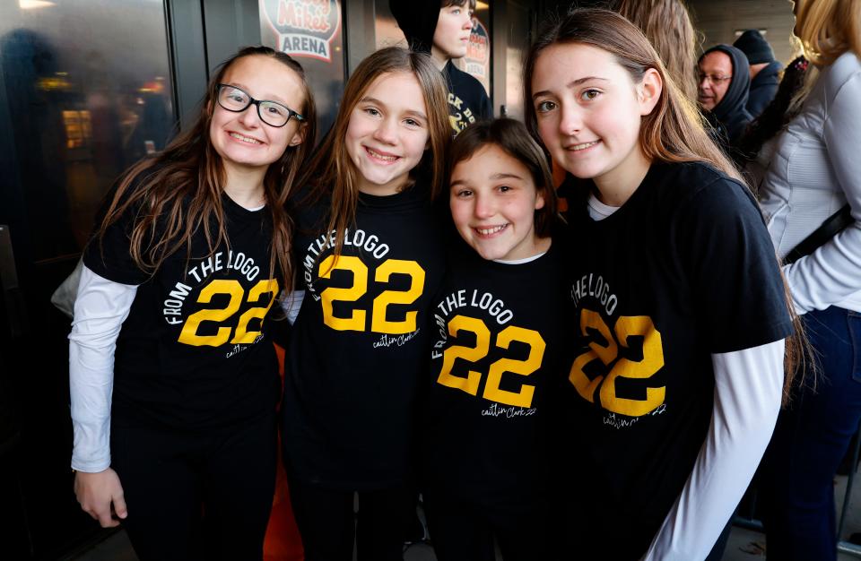 Caitlin Clark fans Layla Lehansky, Leah Railski, Emma Lawrence and Alexa Lehansky, of West Milford, N.J., pose for a photo while waiting in line to enter the arena for the Jan. 5 game between Iowa and Rutgers in Piscataway, N.J.