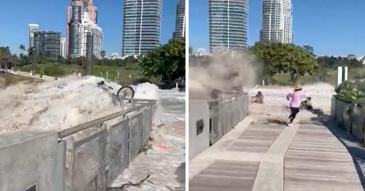 A monster wave sweeps over a footpath at Miami Beach.