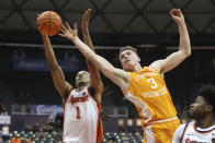 Syracuse forward Maliq Brown (1) and Tennessee guard Dalton Knecht (3) go for a rebound during the second half of an NCAA college basketball game, Monday, Nov. 20, 2023, in Honolulu. (AP Photo/Marco Garcia)