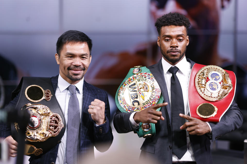 Manny Pacquiao (picutred left) and Errol Spence Jr (pictured right) pose for the media following their press conference at Fox Studios on July 11, 2021 in Los Angeles, California.